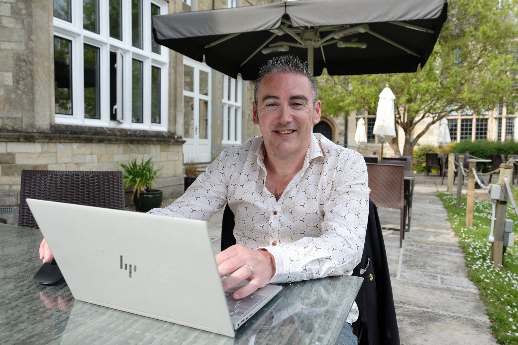 James Sowden providing digital finance support from a laptop